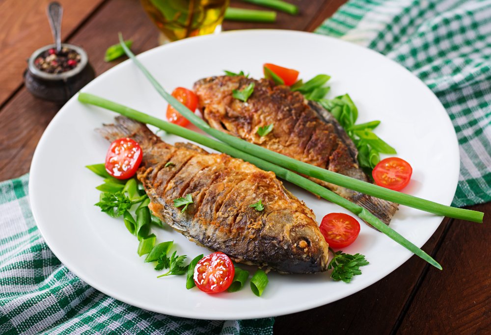 Which Food Is Good for Eyes: Nourish Your Healthy Vision 5 Grilled salmon fillets on a plate, representing foods that are good for eyes, rich in omega-3 fatty acids for retinal health.