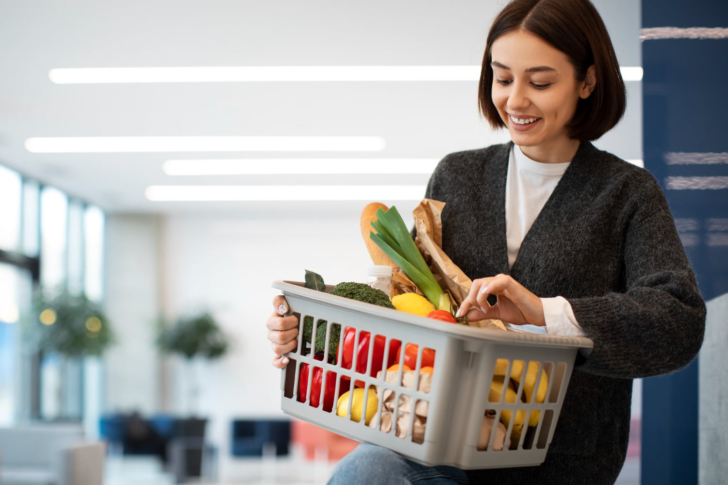 How to Maintain a Healthy Diet on a Budget: 12 Strategies 1 Person shopping for groceries with a cart filled with fresh produce, whole grains, and budget-friendly items, illustrating cost-effective and healthy eating choices.