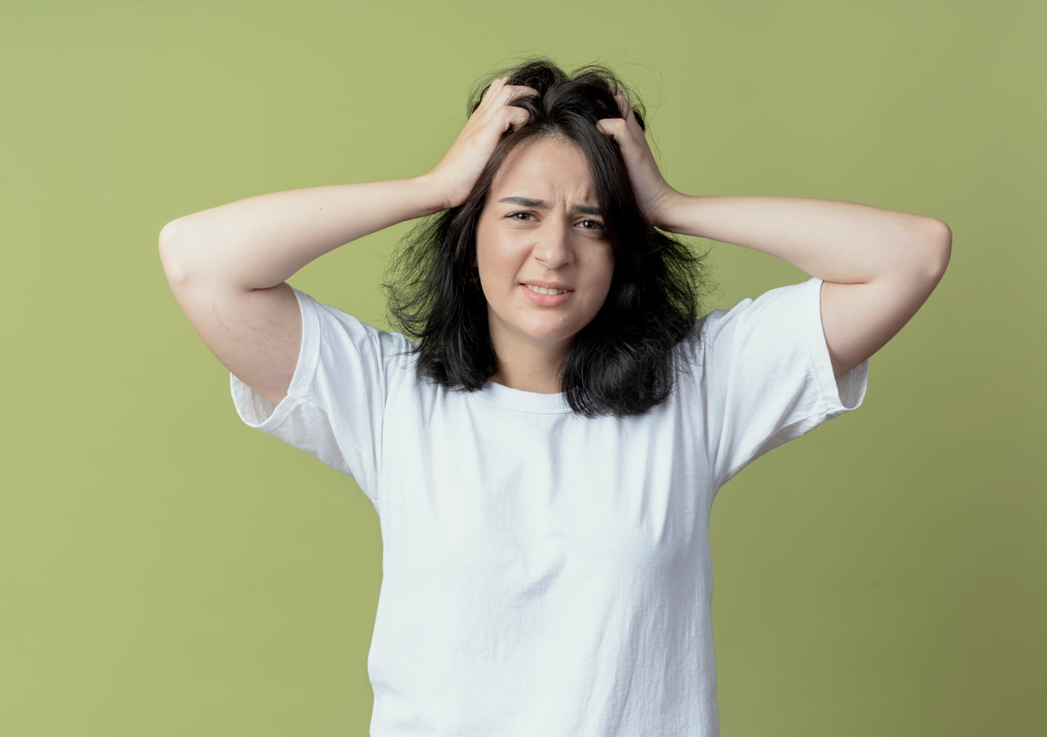 Is It Normal to Lose Hair During Period? 5 Causes and Quick Fixes 1 Woman touching her hair with a concerned expression, reflecting on if it is normal to lose hair during period.