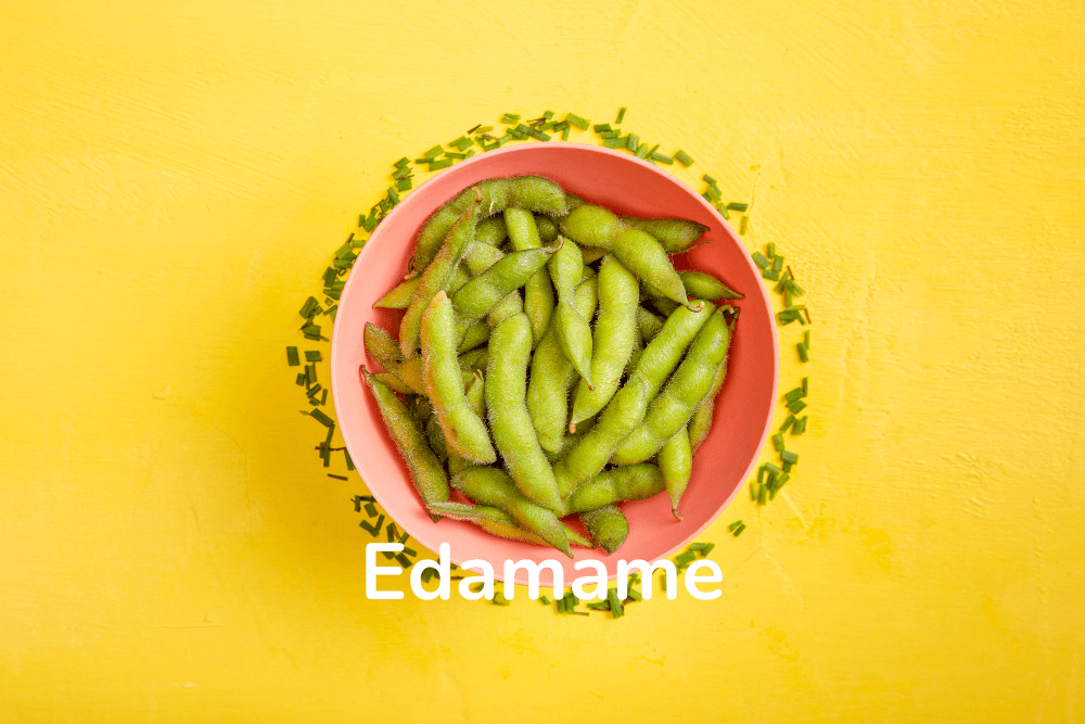 Steamed edamame sprinkled with sea salt, a protein-rich plant snack.