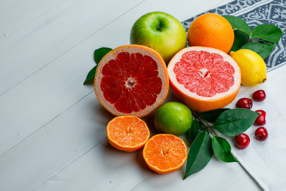 Which Food Is Good for Eyes: Nourish Your Healthy Vision 7 A variety of citrus fruits, including oranges and lemons, emphasizing foods that are good for eyes, high in Vitamin C.