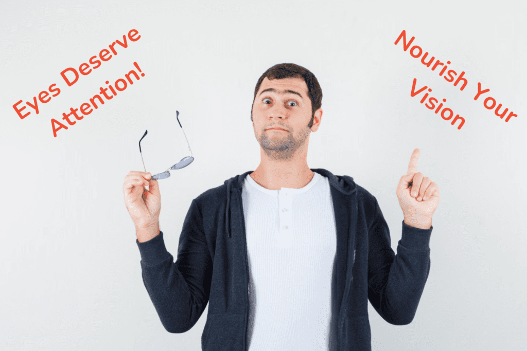 Which Food Is Good for Eyes: Nourish Your Healthy Vision 2 Man holding glasses in one hand, showing disregard for wearing them, with a neutral expression. Which Food Is Good for Eyes.