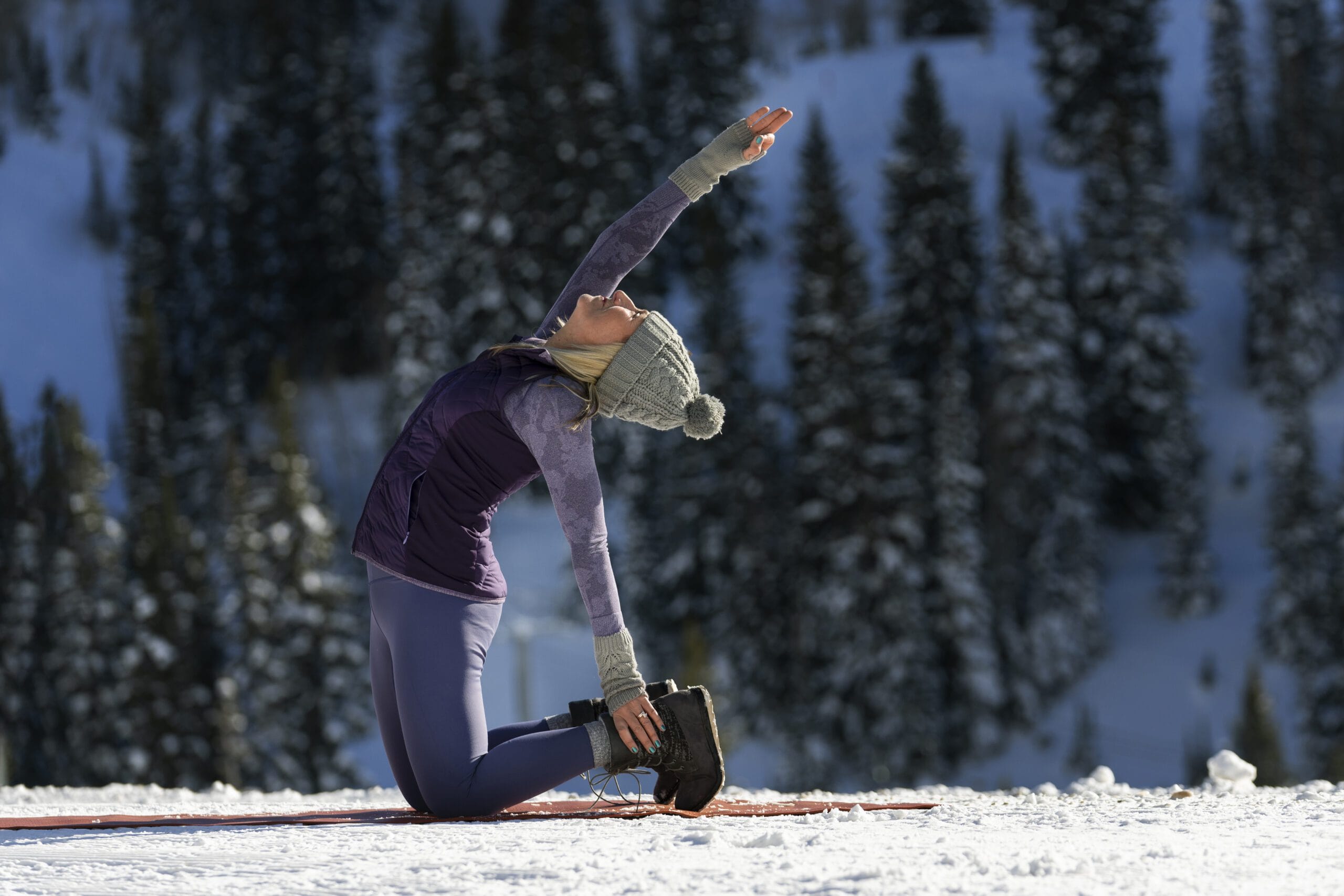 Cold Yoga: A Mindful Chill for Body, Breath & Balance 1 Girl doing cold yoga in a snowy, cold environment with calm expression, practicing mindfulness and balance