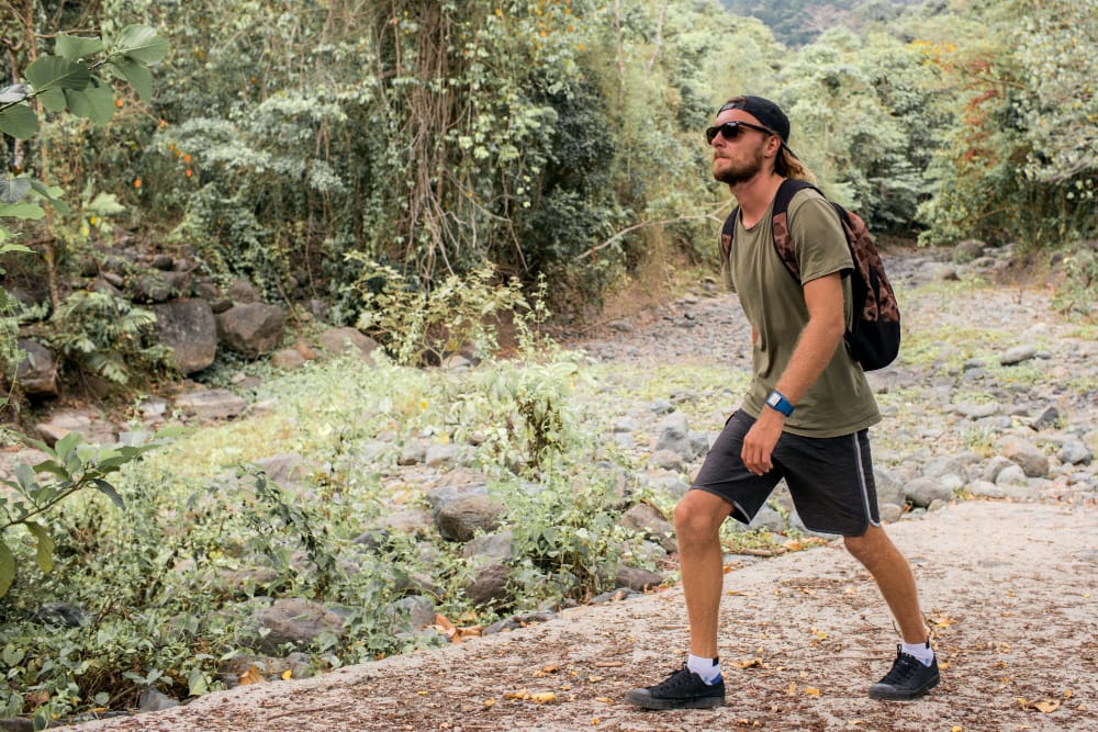 How to Start Rucking: 7 Powerful Steps for Beginners 2 How to start rucking: man walking alone with weighted backpack in outdoor setting